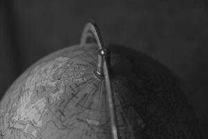 Home Black and white close-up of a world globe highlighting the northern hemisphere.